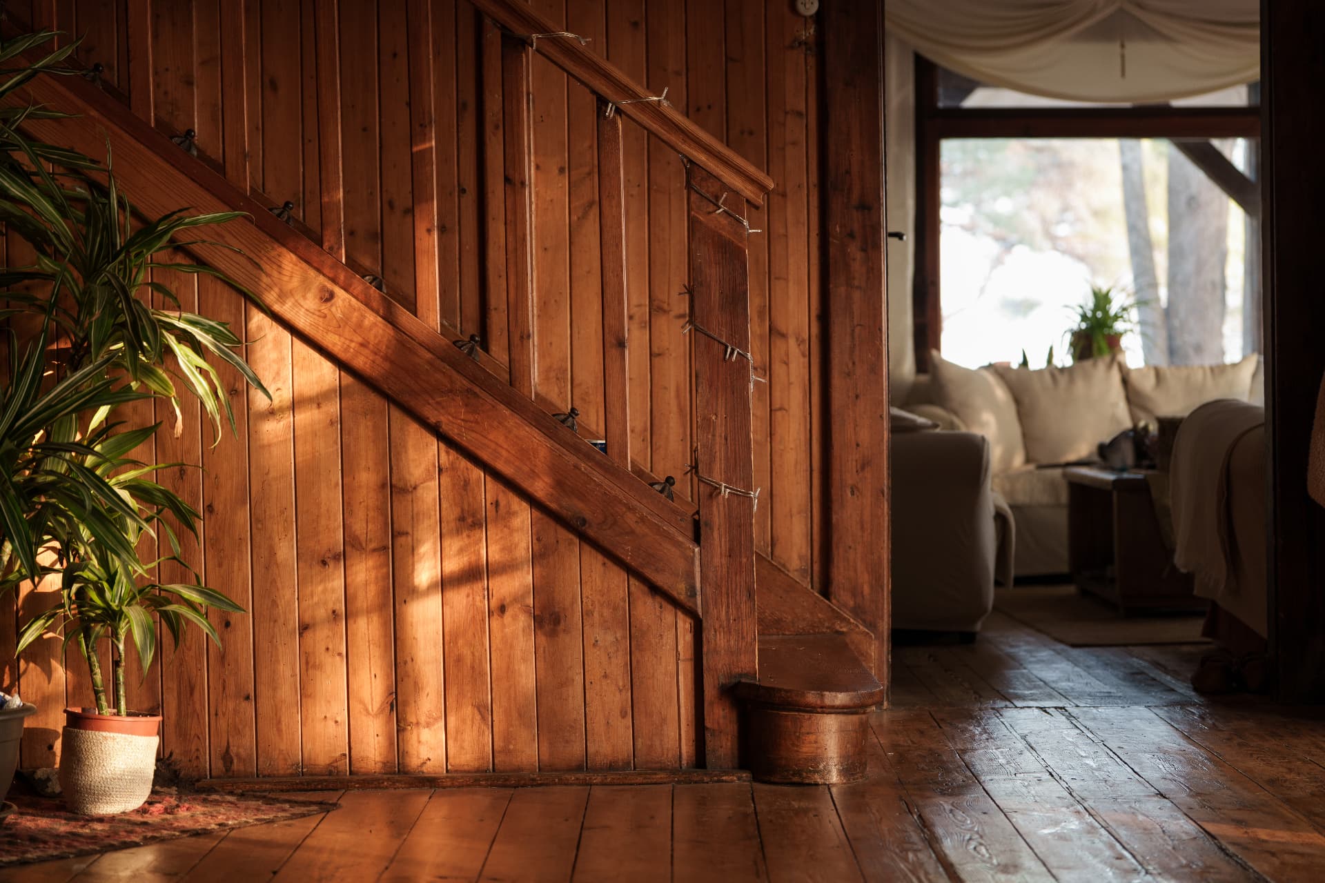 Warm light on the wooden staircase inside the house