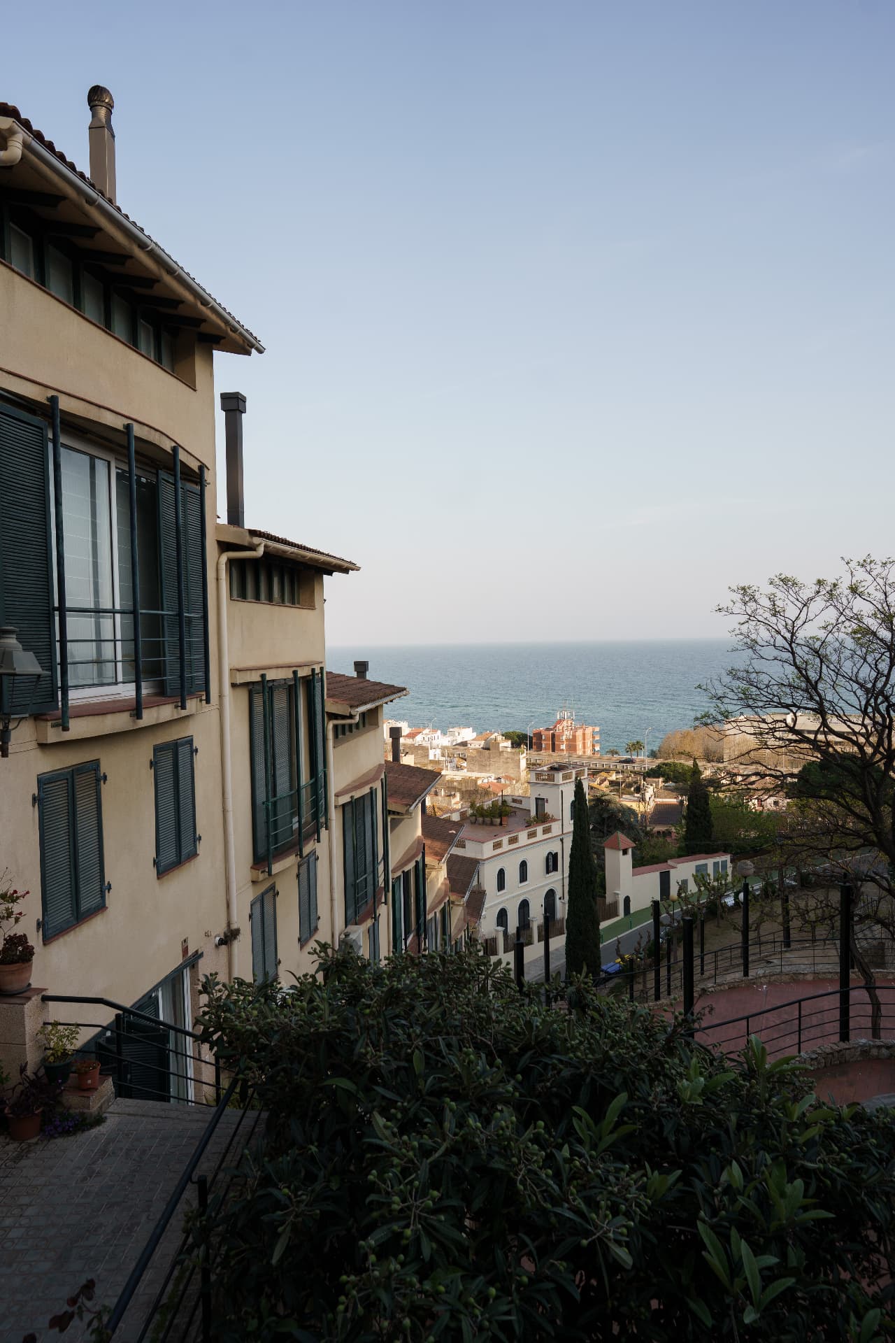 Houses descending toward the sea from the hillside